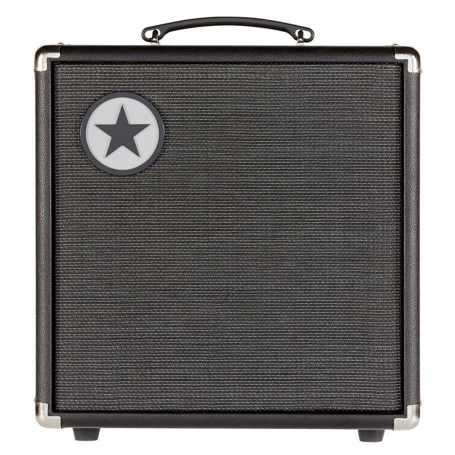 Black amplifier cabinet with a textured front grille, metal corner protectors, a top handle, and a circular logo with a black star in the top left corner.