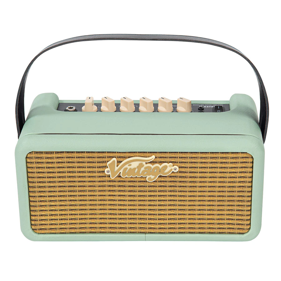 Light green portable amplifier with a woven front grill, cream control knobs on top, a black carrying handle, and "Vintage" logo on the front.