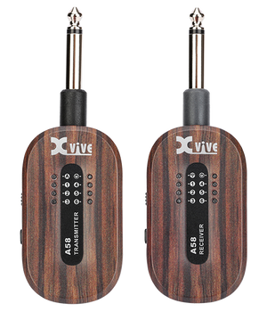 Two Xvive wireless transmitters with a woodgrain finish, labeled A58 Transmitter and A58 Receiver, each with indicator lights and a 1/4-inch plug.