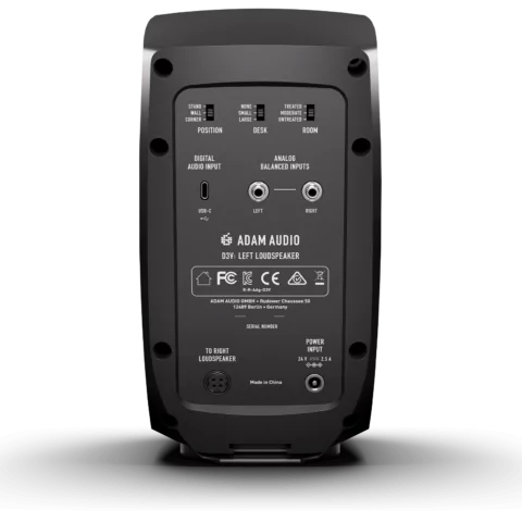 Rear panel of an Adam Audio D3V left loudspeaker showing digital and analog inputs, control switches, power port, and connection to right loudspeaker.