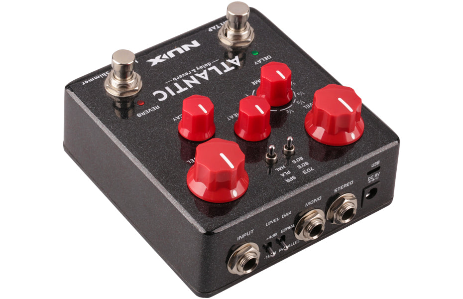 Black FX pedal with five red control knobs, two silver footswitches, toggle switches, and input/output jacks labeled input, mono, and stereo.