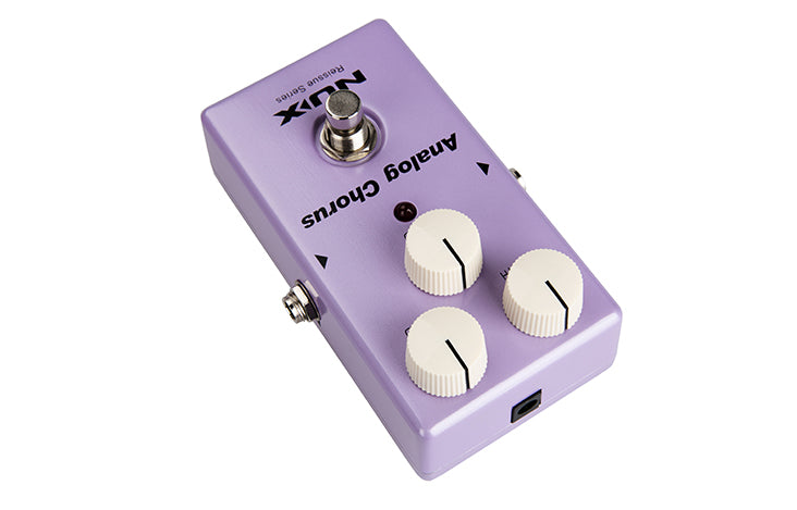 Light purple FX pedal labeled "Analog Chorus" with three white knobs, a footswitch, and a single LED indicator. Rectangular shape.