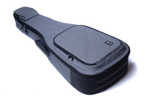 A gray padded acoustic guitar gig bag with multiple zippered pockets, designed for carrying and protecting a guitar.