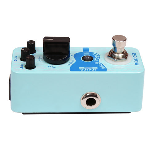 Light blue FX pedal with three small black knobs, one large knob, a silver footswitch, and input/output jacks on the sides.