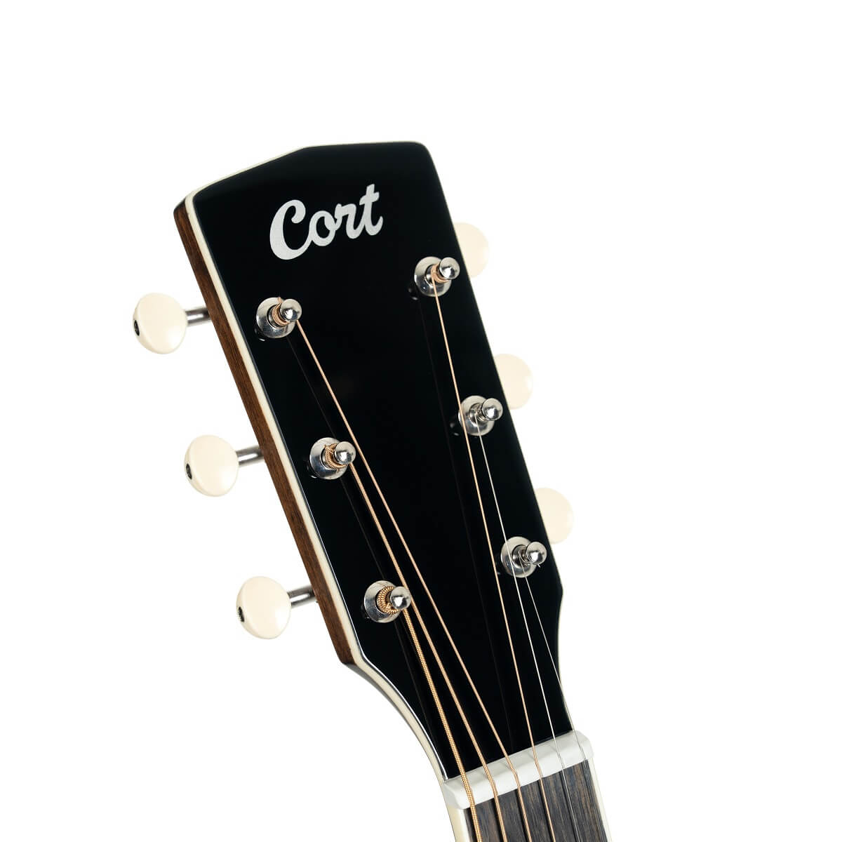 Close-up of a Cort acoustic guitar headstock with six tuning pegs and steel strings, black finish with white logo.