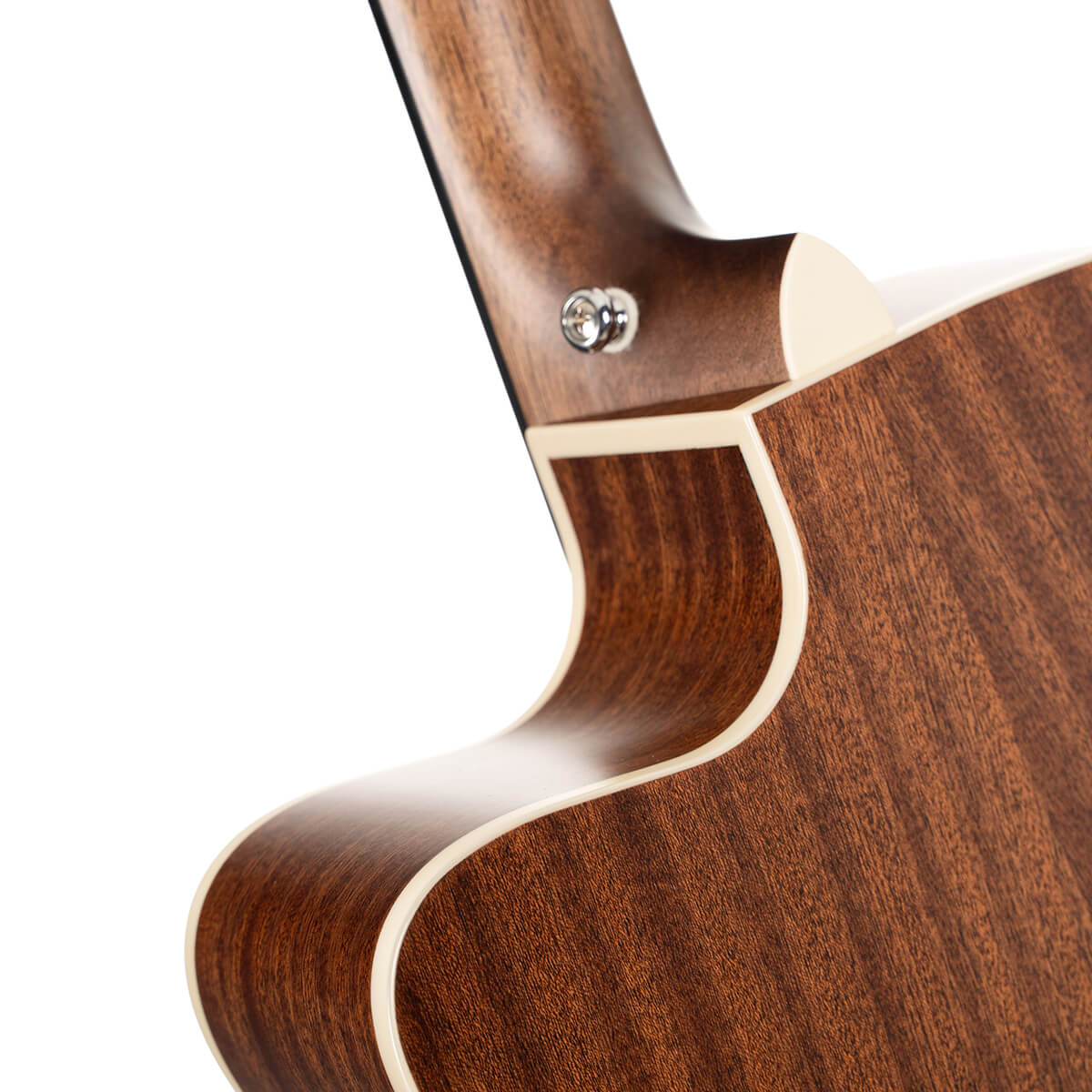 Close-up of an acoustic guitar’s neck joint, showing smooth brown wood with cream binding and a metal strap button.