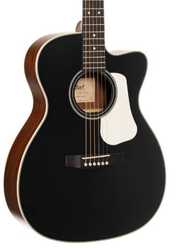 Black acoustic guitar with a white pickguard, six strings, and a cutaway body design; wood grain visible on the sides and back.