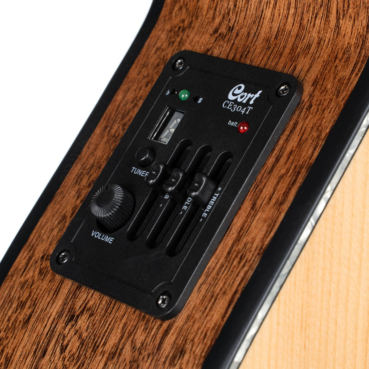 Close-up of an acoustic guitar’s onboard preamp, showing volume knob, tuner switch, three sliders for treble, middle, bass, and LED indicators.