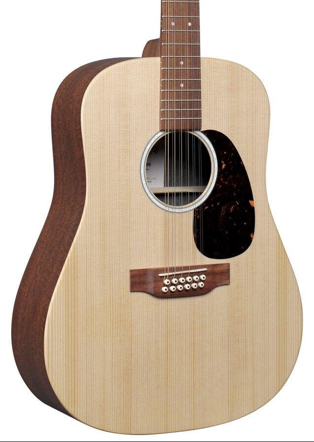 Natural wood acoustic guitar with a light spruce top, dark sides, twelve strings, round sound hole, pickguard, and dot inlays on the fretboard.