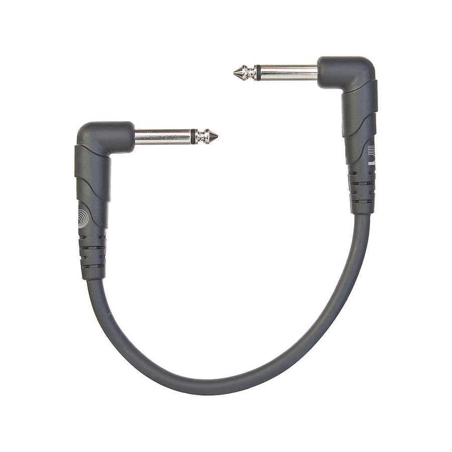 Short audio patch cable with two right-angle 1/4 inch plugs connected by a flexible black cord, used for linking audio equipment.