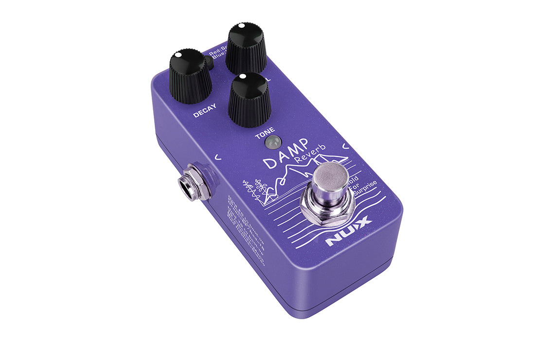 Purple FX pedal labeled "Damp Reverb" with three black knobs for mix, decay, and tone, a silver footswitch, and NUX branding.
