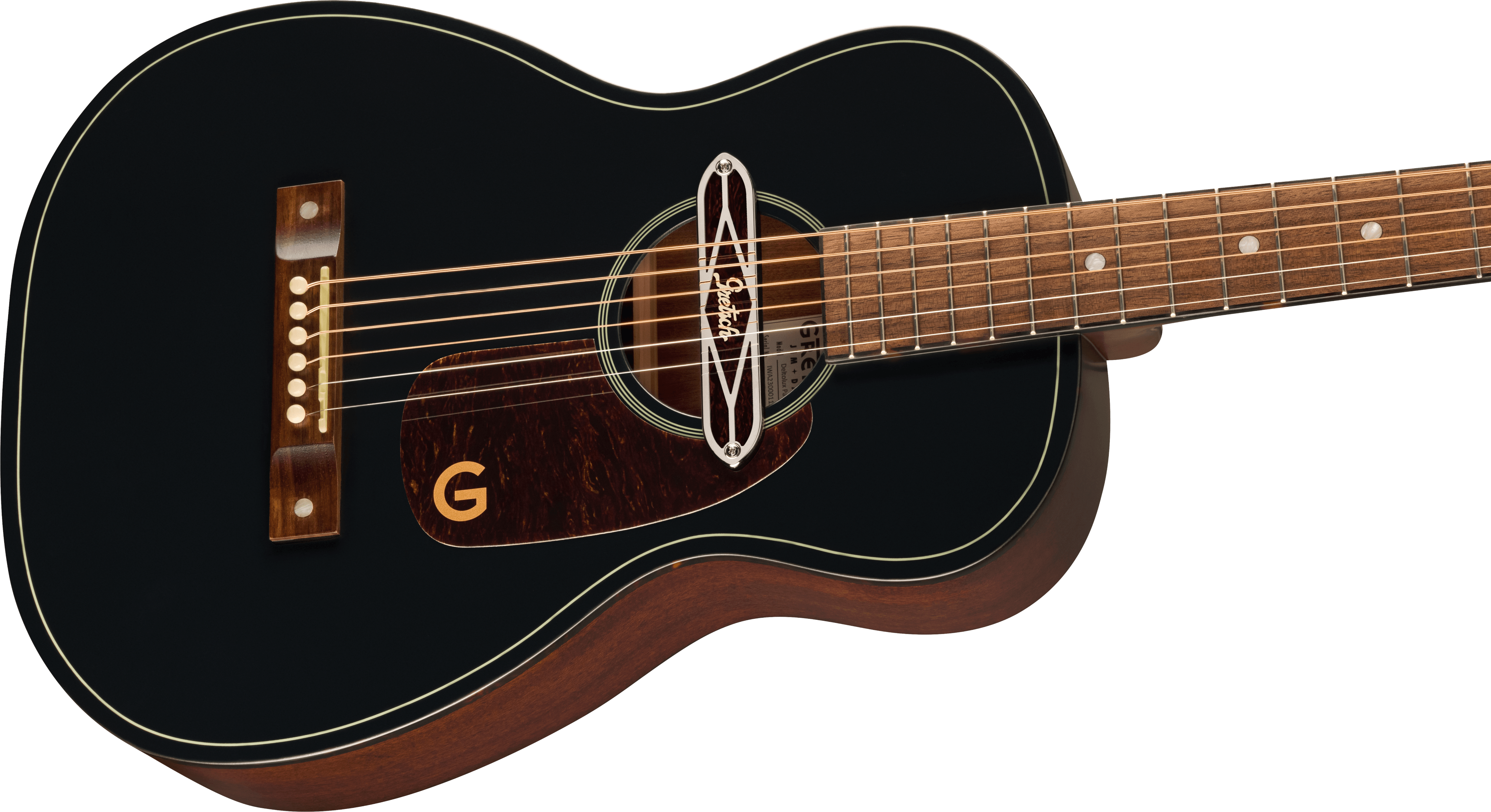 Small black acoustic guitar with a dark brown pickguard, gold “G” logo, contrasting wood bridge, and metal ornament over the sound hole.