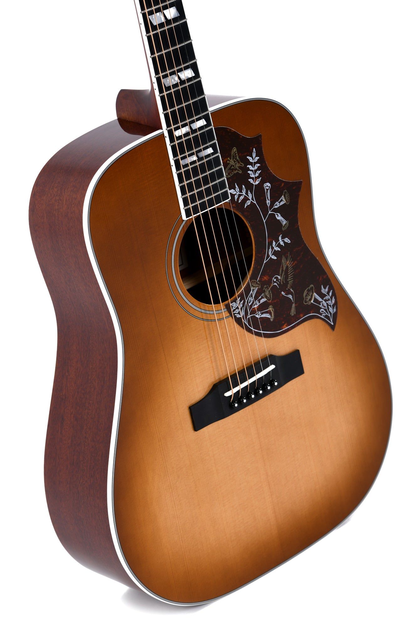 Brown acoustic guitar with a sunburst finish and a large pickguard featuring floral and hummingbird designs in white and gold.