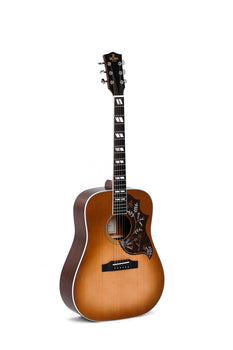 Sunburst acoustic guitar with square inlays on the fretboard and a dark pickguard featuring a white floral design.