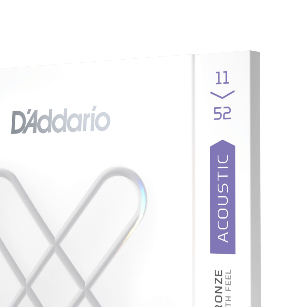 D'Addario acoustic guitar strings, gauge 11-52, in white packaging with a purple "ACOUSTIC" label on the side.