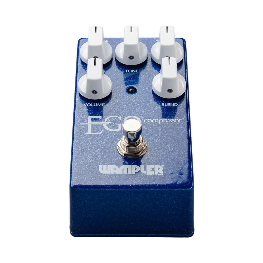 Blue Wampler Ego Compressor FX pedal with five white knobs labeled volume, tone, blend, and a metal footswitch at the bottom center.