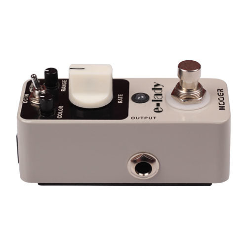 Compact effects pedal with a large white RATE knob, small toggle and black knob, footswitch, and single output jack on beige casing labeled "e-lady."