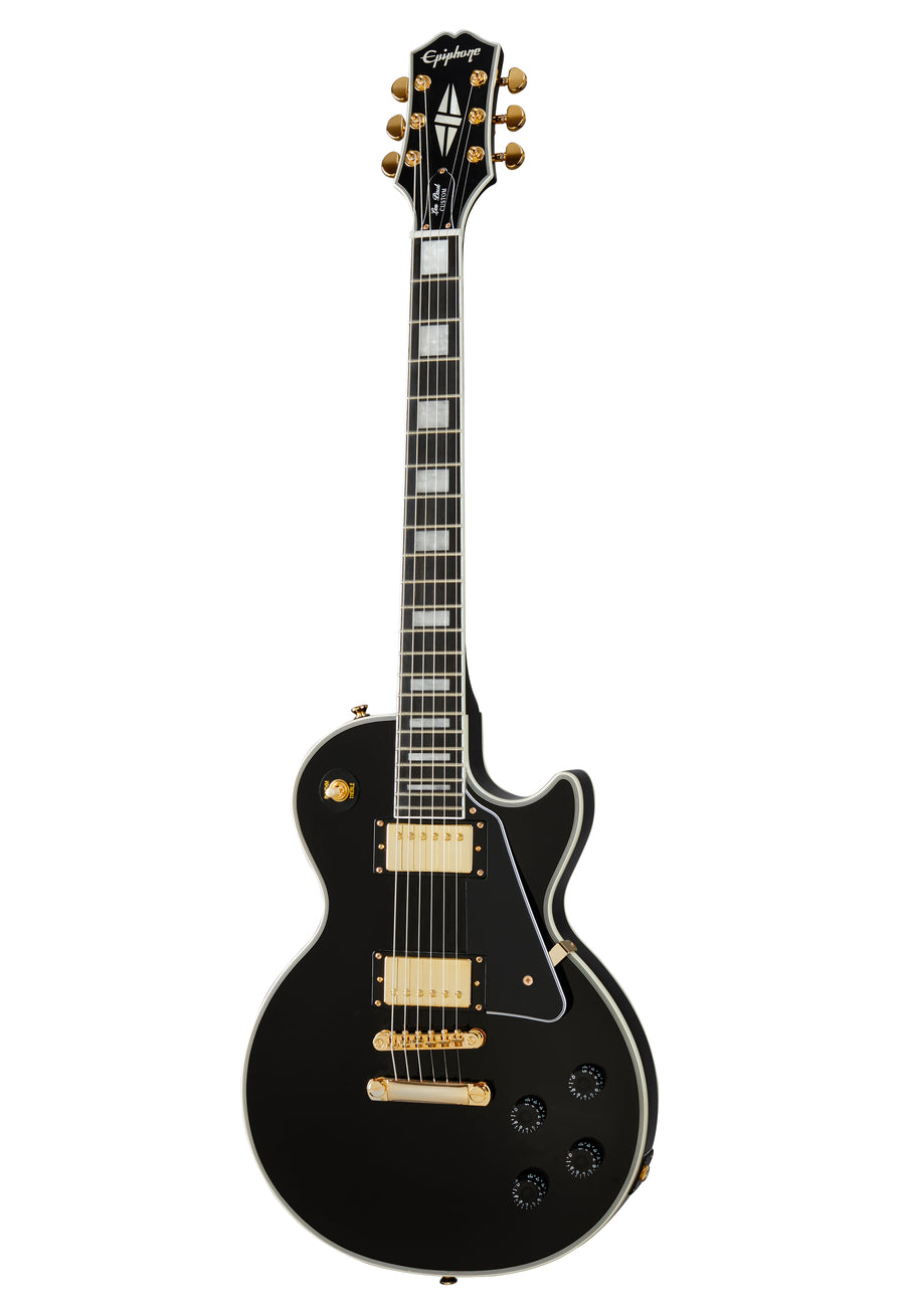 Black electric guitar with gold hardware, two humbucker pickups, four black control knobs, and rectangular inlays on a dark fretboard.