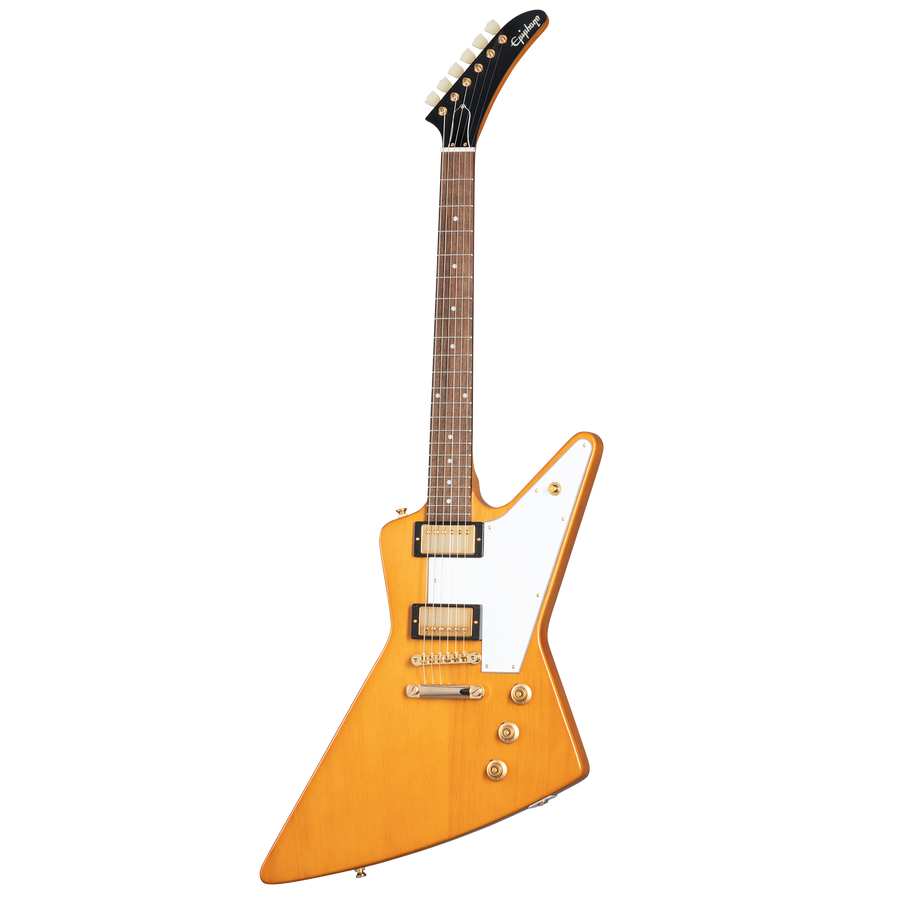 Electric guitar with a sharp, angular light brown body, white pickguard, two humbucker pickups, and gold hardware.
