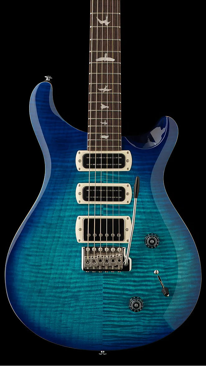 Blue electric guitar with a flamed maple top, three pickups, two control knobs, a tremolo bridge, and bird inlays on a dark fingerboard.