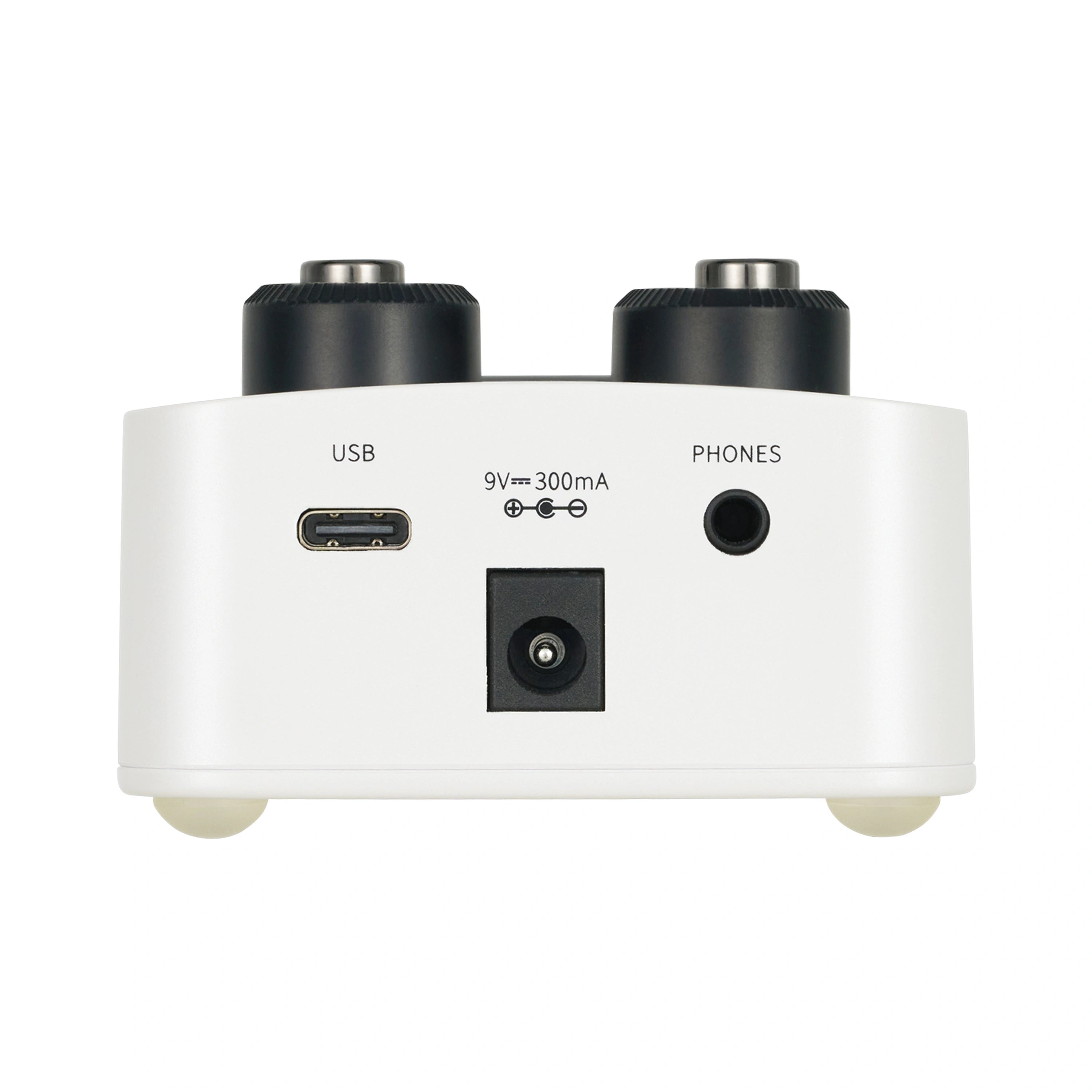 White FX pedal rear view showing USB-C port, 9V power jack, and 1/4 inch headphones jack, with two large black control knobs on top.