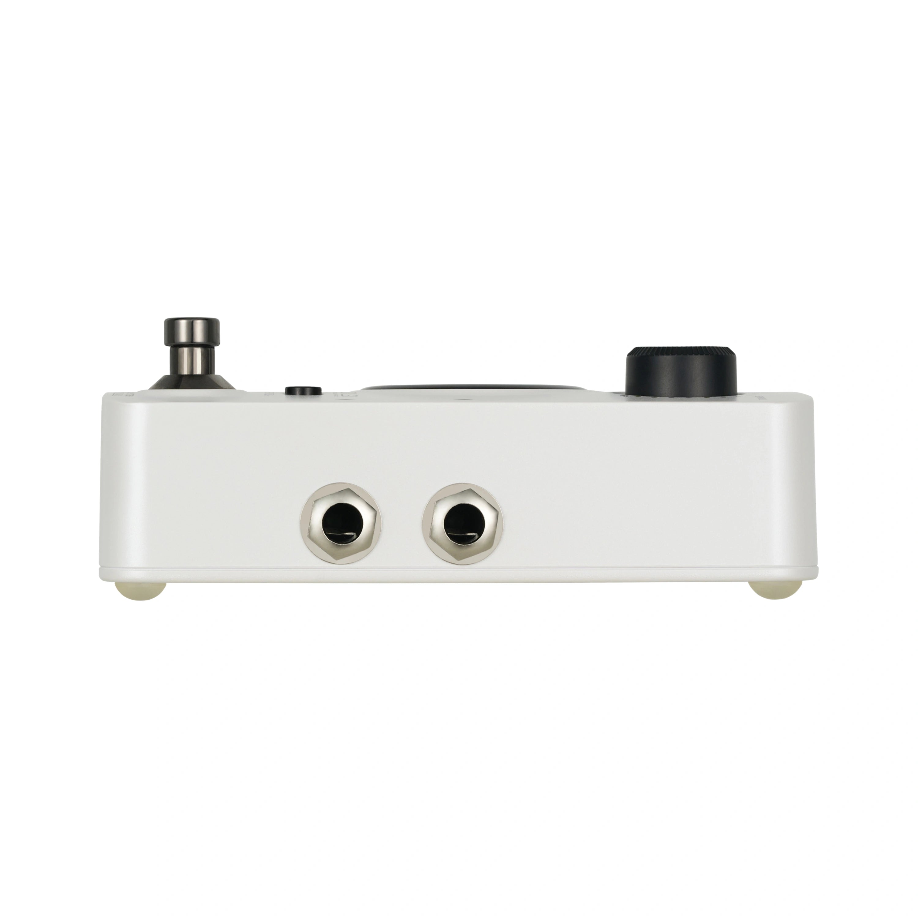 White FX pedal with two input/output jacks, a footswitch on the left, and a large black knob on the right.