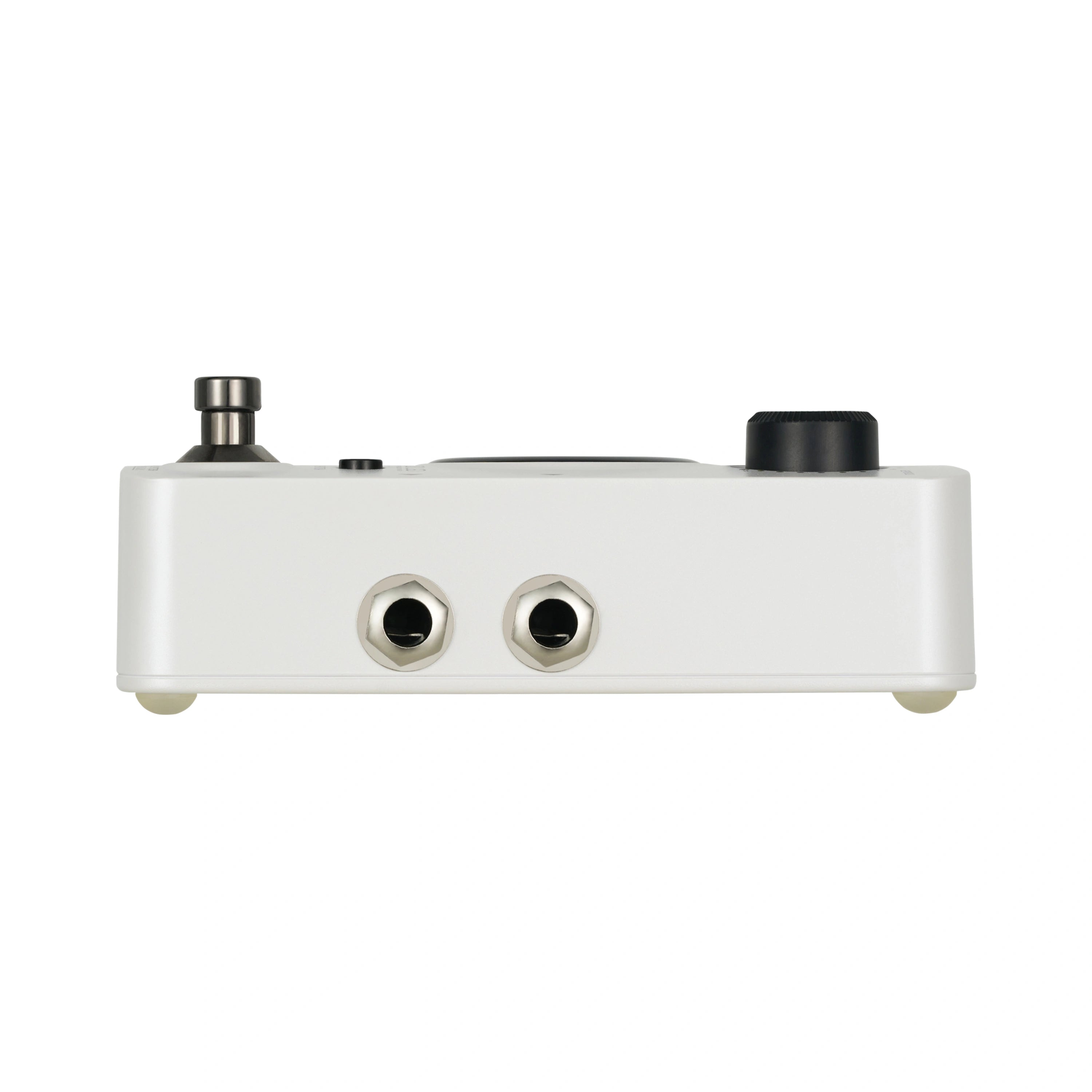 White FX pedal showing two input/output jacks, a footswitch on the left, and a large black knob on the right.