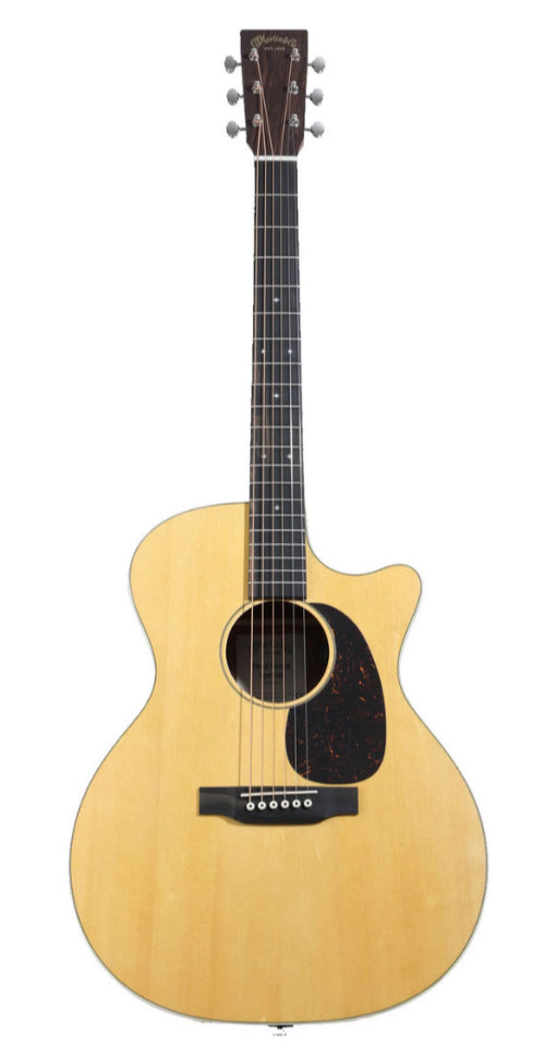 Natural wood acoustic guitar with a single cutaway, six strings, dark pickguard, and chrome tuning pegs.