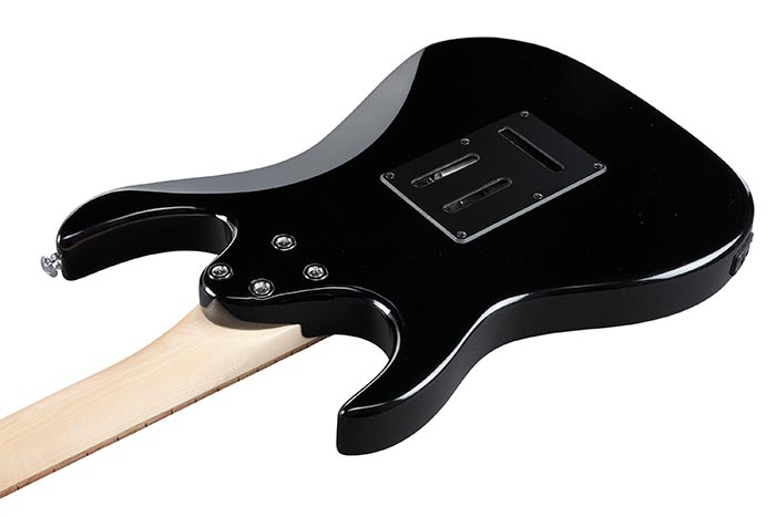 Black electric guitar shown from the back, revealing a natural wood neck and a rectangular electronics cover plate with screws on the body.