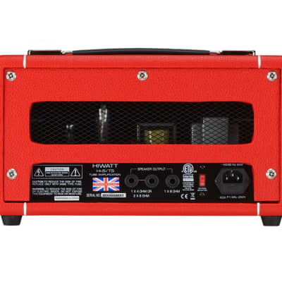 Red Hiwatt tube amplifier head rear panel showing vents, speaker output jacks, UK flag sticker, power switch, and AC power input socket.