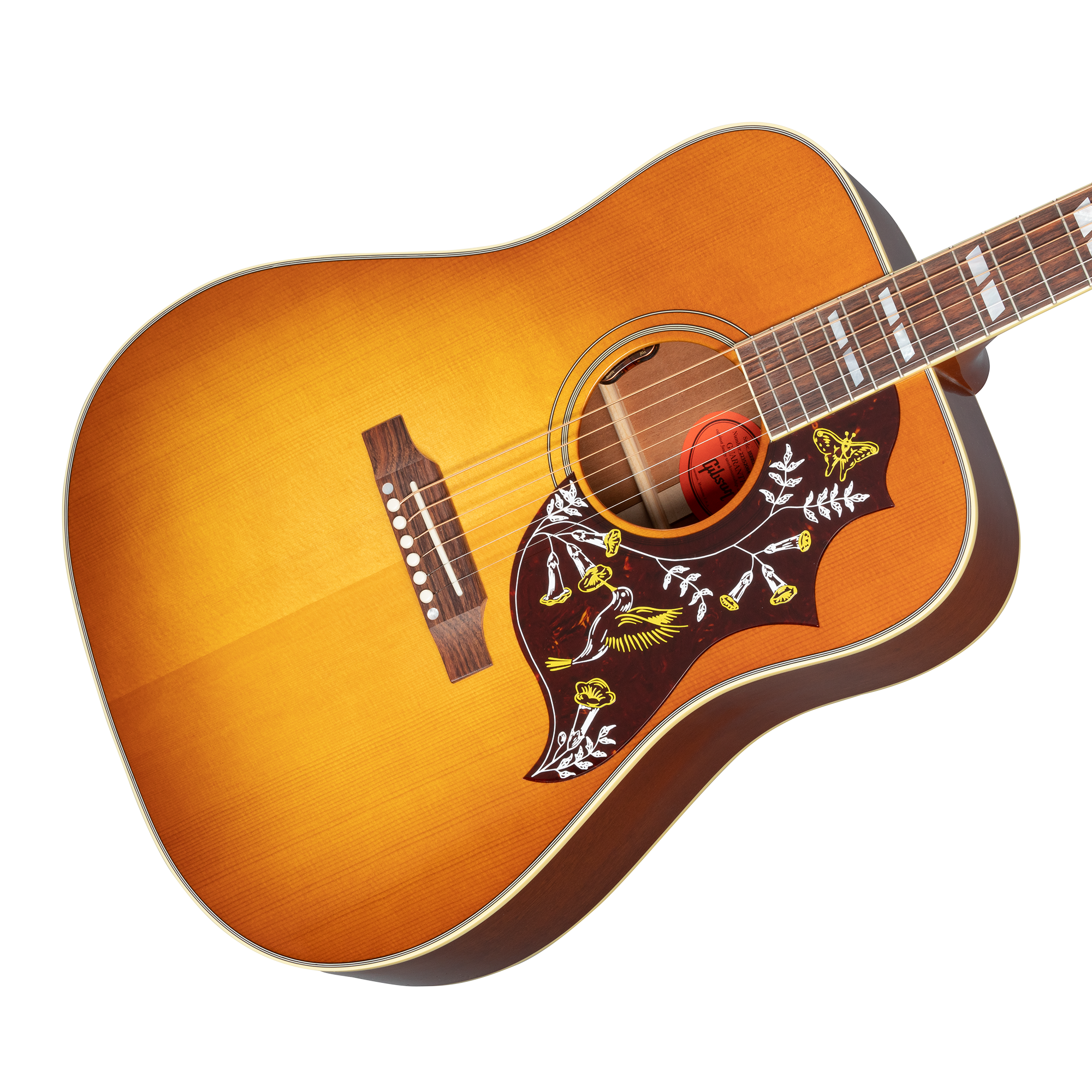 Sunburst acoustic guitar with a detailed pickguard featuring yellow birds, flowers, and leaves design; mother-of-pearl inlays on the fretboard.