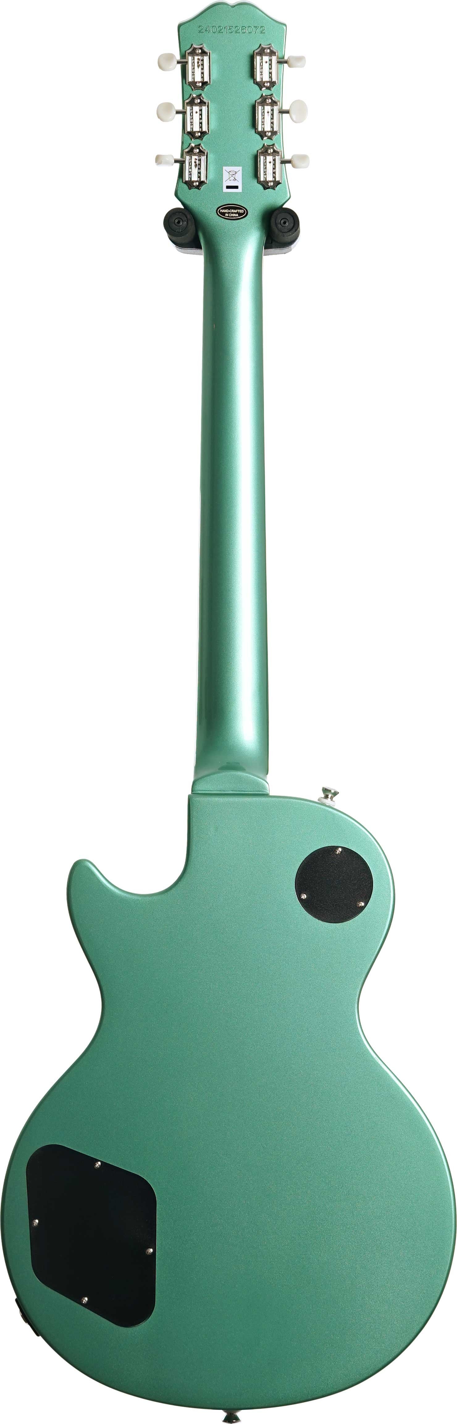 Metallic green electric guitar shown from the back, with six white tuning pegs and two black electronics cavity covers on the body.