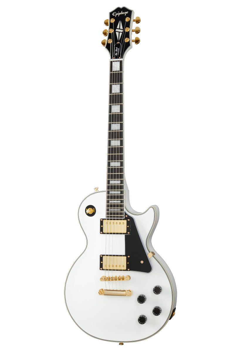 White electric guitar with gold hardware, black pickguard, rectangular fretboard inlays, and four black control knobs. Classic single cutaway body shape.