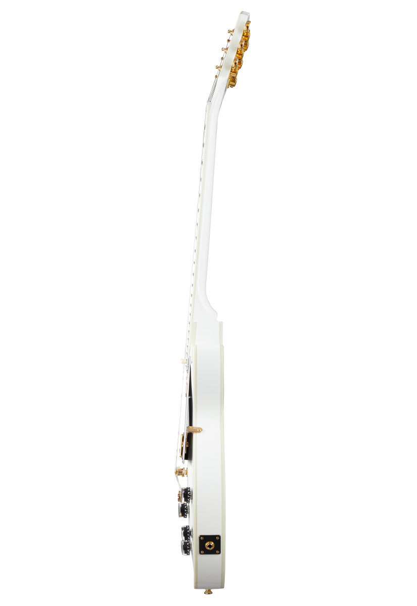 White electric guitar shown from the side, revealing its thickness, gold tuning pegs, control knobs, and input jack.