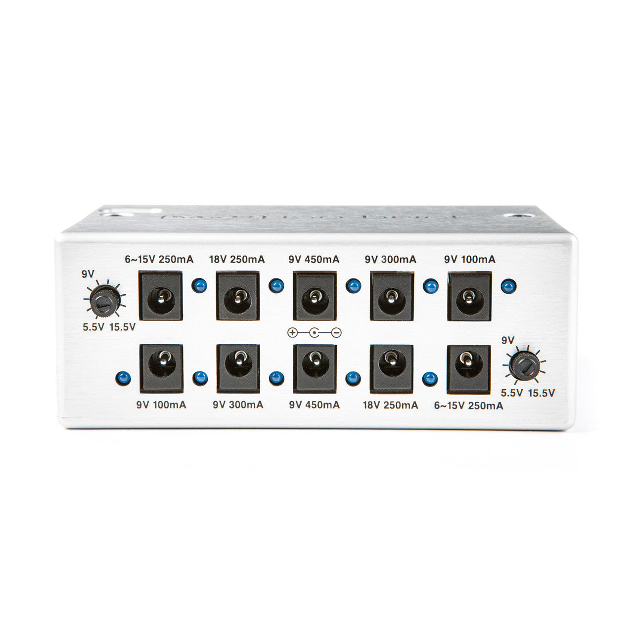 Silver effects pedal power supply with twelve DC output jacks, two control knobs, and labeled voltage and current ratings above each jack.