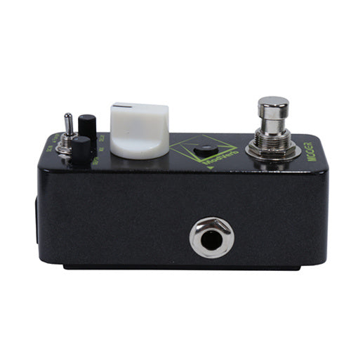 Compact black effects pedal with a large white knob, two small black controls, a footswitch, and a side-mounted input jack.