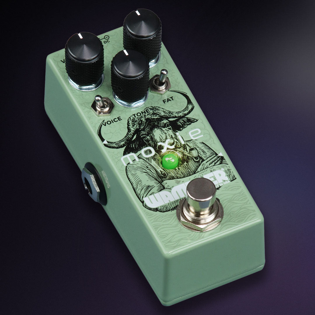 Light green guitar effects pedal with three black knobs, two toggle switches, a footswitch, and an illustration of a bull-headed figure.