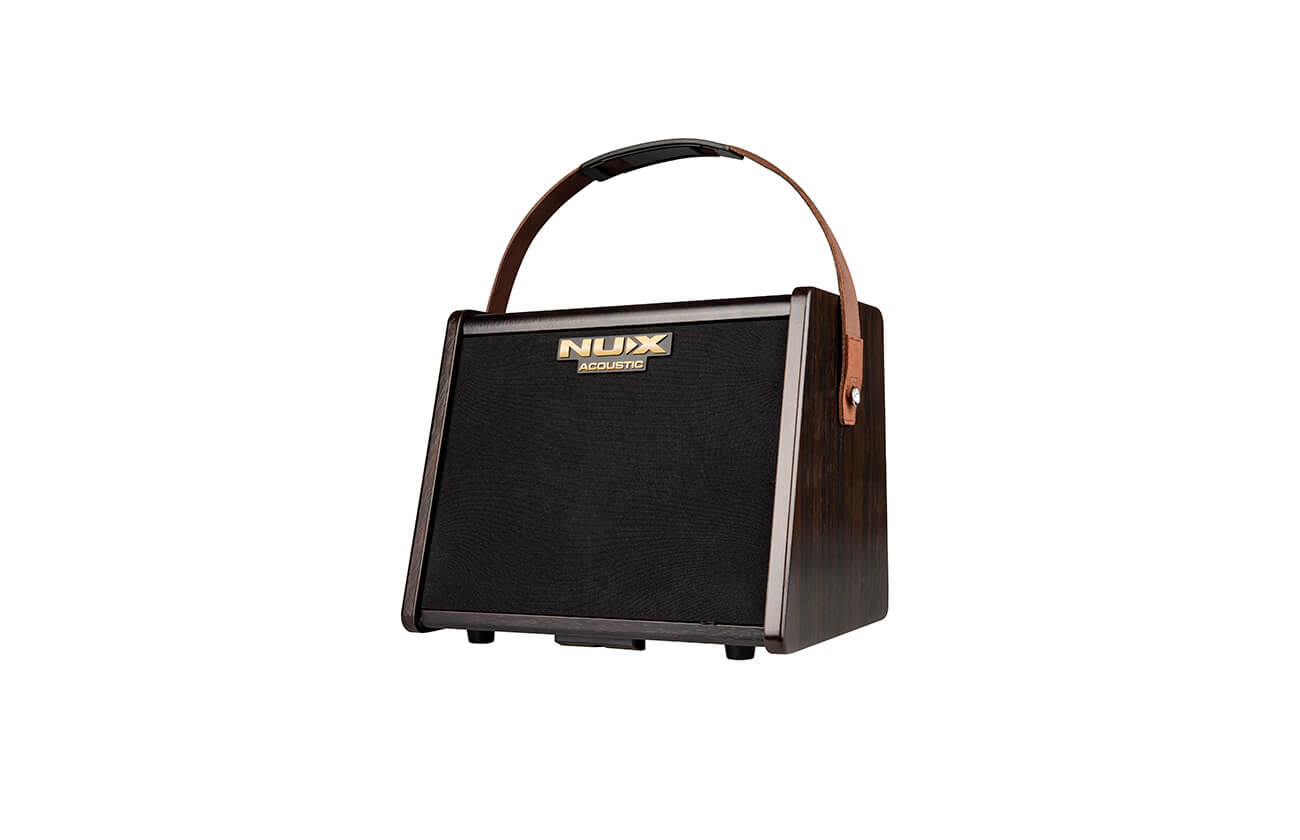 Brown wood-finish amplifier with a black front grille, gold "NUX Acoustic" logo, and a brown leather carrying handle attached to the sides.