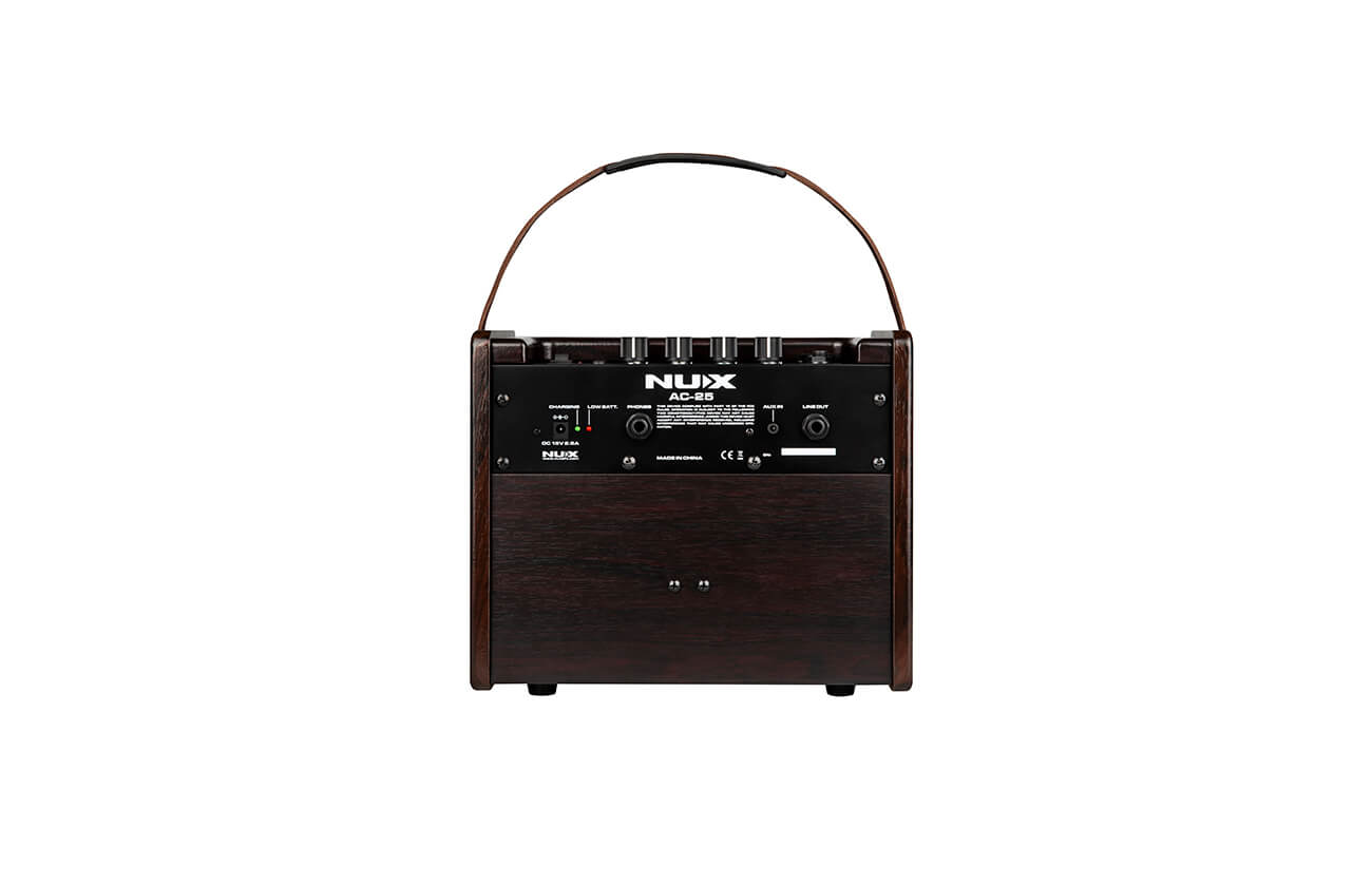Dark wood-paneled amplifier with a black control panel, labeled "NUX AC-25," top knobs, rear input jacks, and a curved carrying handle.