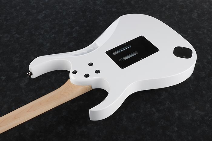 White electric guitar body and pale wood neck, viewed from the back; black rectangular and round covers with three screw holes visible.