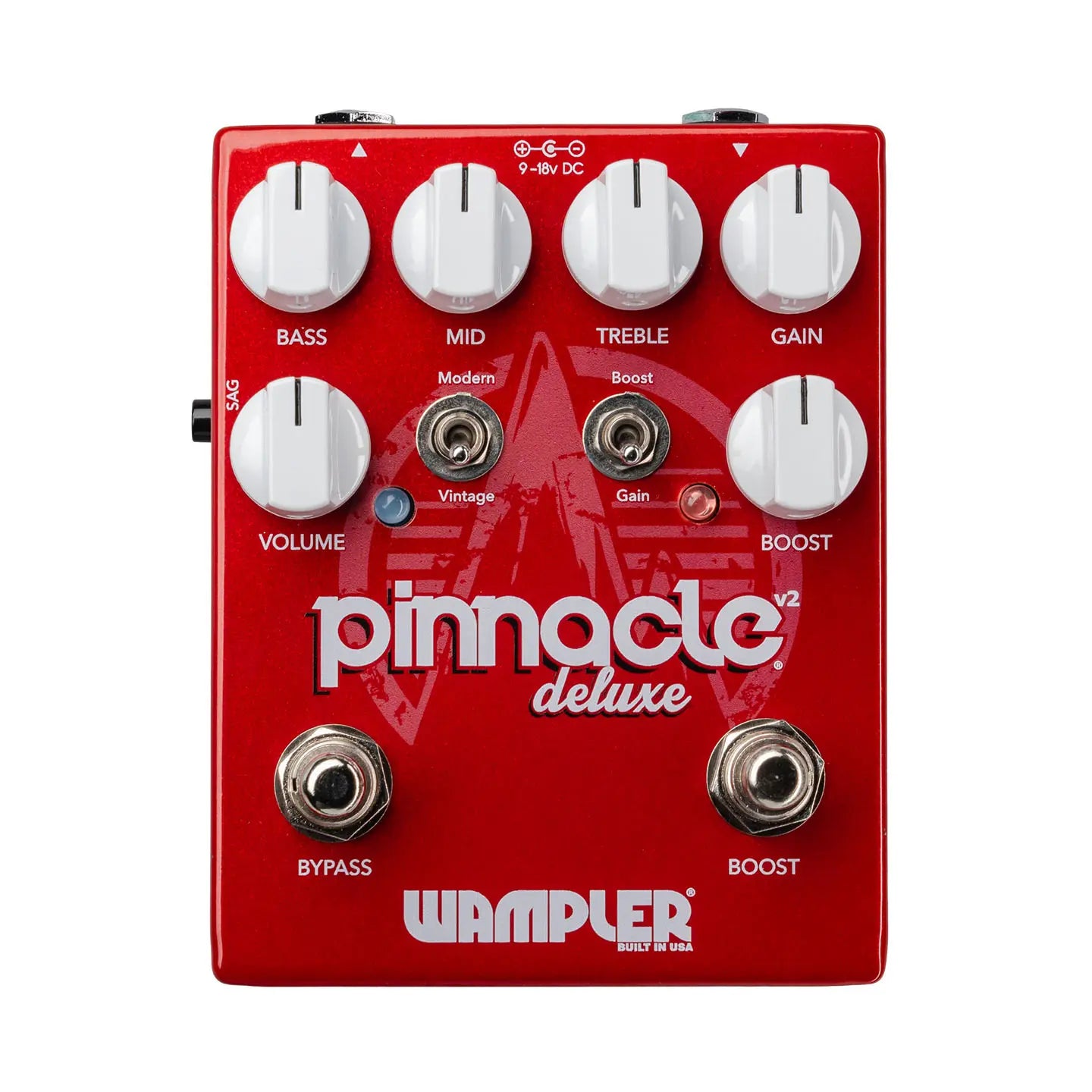 Red Pinnacle Deluxe V2 FX pedal with six white knobs for bass, mid, treble, gain, volume, boost, two footswitches, and two toggle switches.
