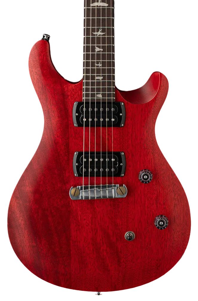 Red electric guitar with two black humbucker pickups, two control knobs, bird inlays on the fretboard, and a wraparound bridge.