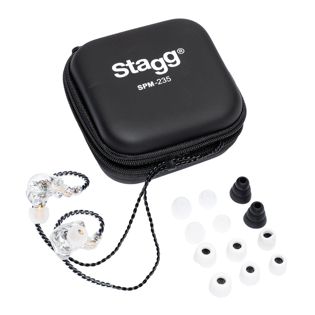 Black zippered case labeled "Stagg SPM-235," clear in-ear monitors with braided cable, and multiple sizes of white and black silicone ear tips.