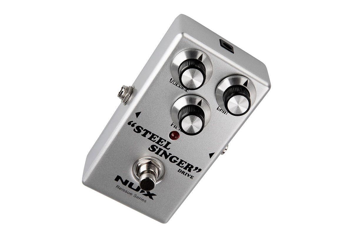 Silver FX pedal labeled "Steel Singer" with three dials for volume, gain, and filter, a footswitch, and a single red LED indicator.