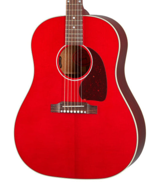 Bright red acoustic guitar with a dark red pickguard, white trim, six strings, and a wooden bridge with white bridge pins.