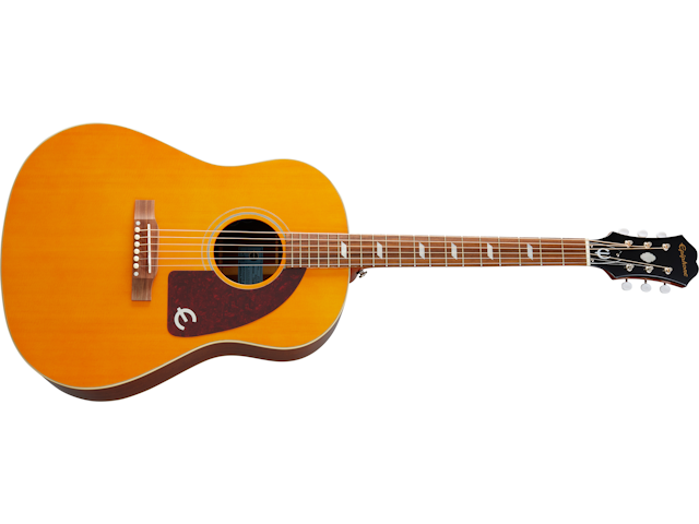 Light brown acoustic guitar with a dark pickguard, round sound hole, six strings, and white tuning pegs on a black headstock.