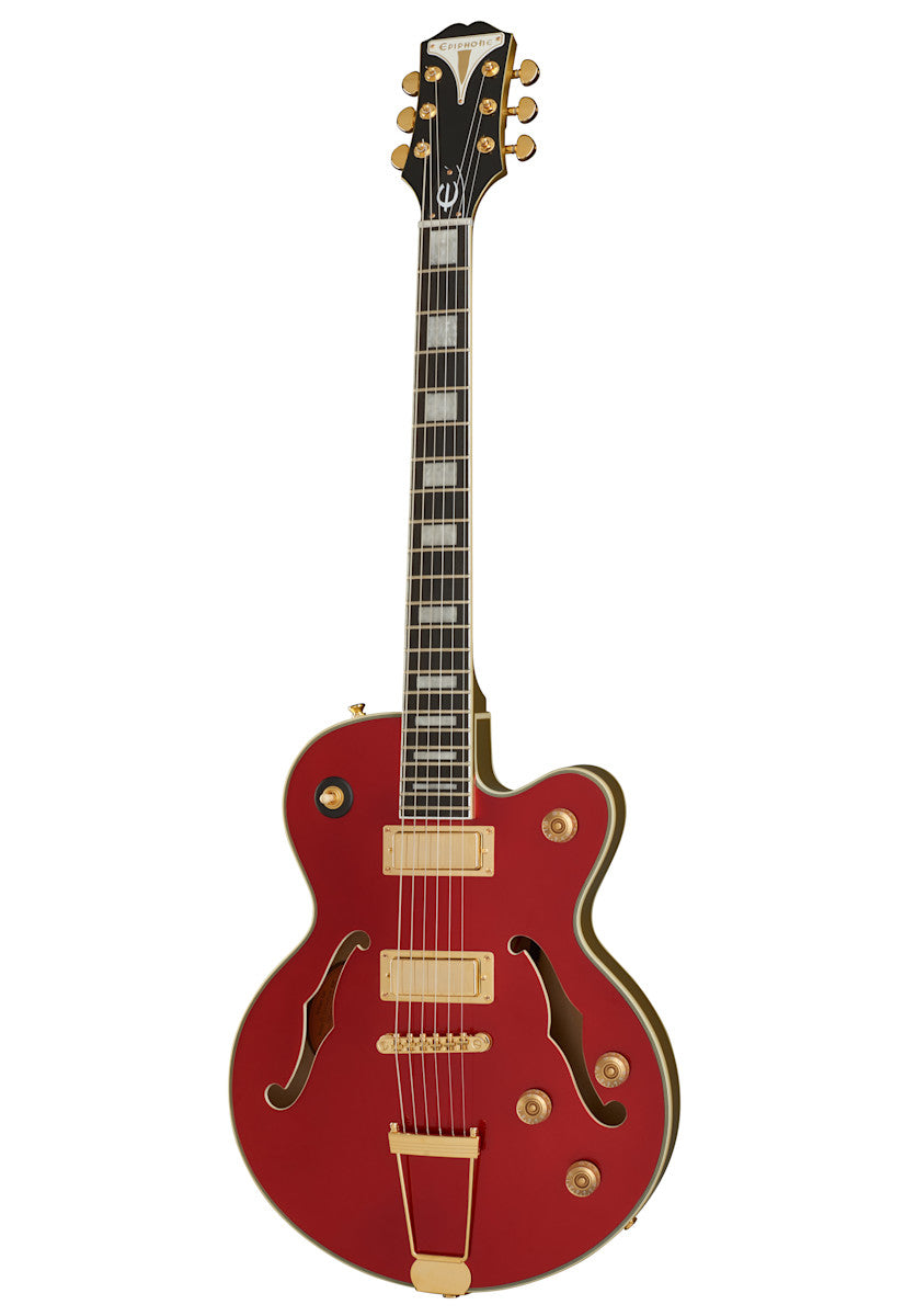 Red electric guitar with gold hardware, two humbucker pickups, four control knobs, and f-shaped sound holes. Rectangular pearl inlays on the fretboard.