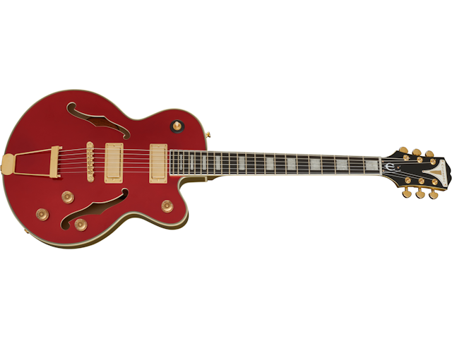 Red hollow body electric guitar with gold hardware, two humbucker pickups, f-holes, four control knobs, and a black headstock with gold tuners.