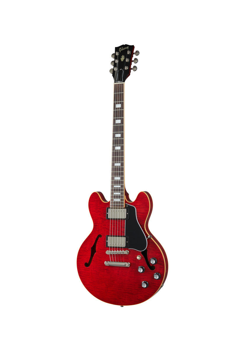 Red semi-hollow electric guitar with dual humbucker pickups, f-hole on left side, four control knobs, and a black pickguard.