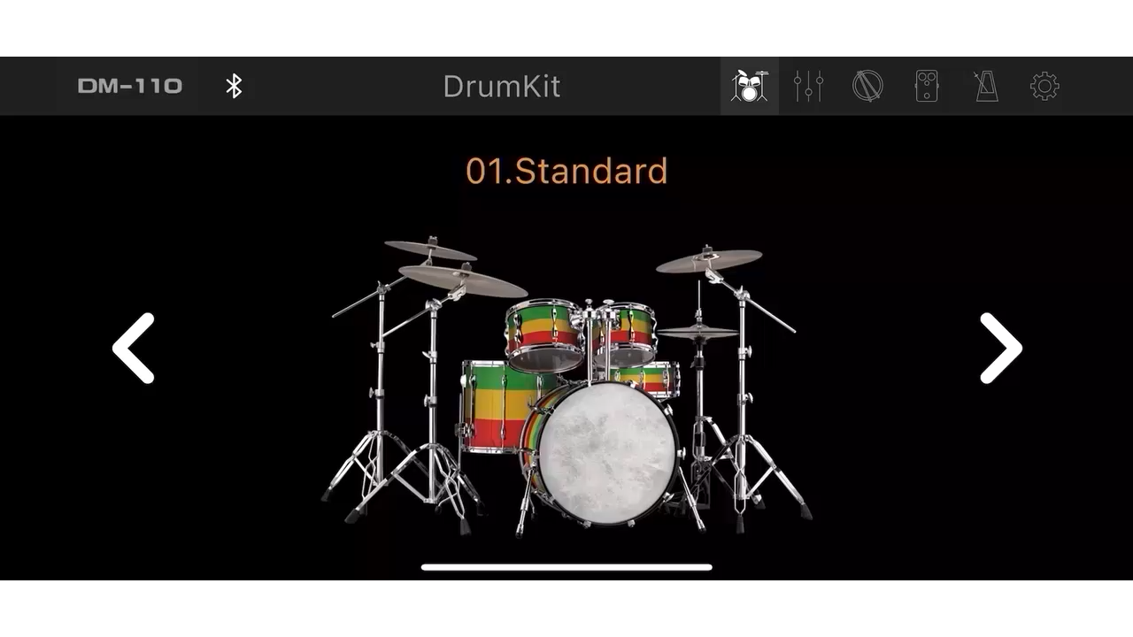 Electronic drum kit with red, yellow, and green stripes shown on a black display screen labeled "01. Standard" with navigation arrows.